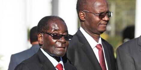 Former Zimbabwe President Robert Mugabe alongside former Minister of Higher education, Jonathan Moyo on July 6, 2015. 
