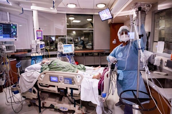 A nurse treating a Covid-19 patient in the intensive care unit of Sharp Grossmont Hospital in La Mesa, Calif.