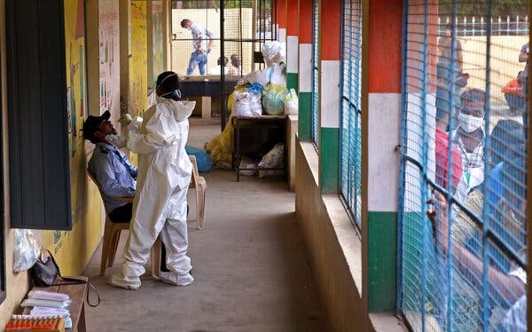 A health worker took a swab sample for a coronavirus test in Bangalore, India, on Monday.