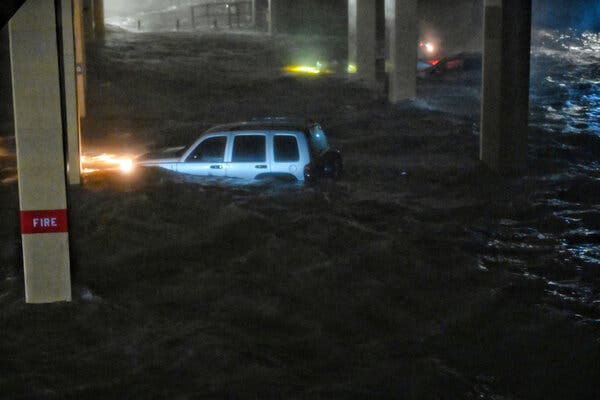 Storm surge swamped vehicles in Biloxi, Miss., when Hurricane Zeta made landfall in 2020.