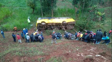 Residents attempt to save an overturned School Bus along Meru-Nairobi Highway in Tharaka Nithi.
