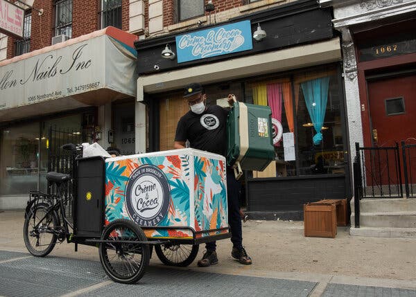Omar Thorpe, one of the founders of Crème and Cocoa Creamery, loaded ice cream onto his refrigerated bike cart on May 28.