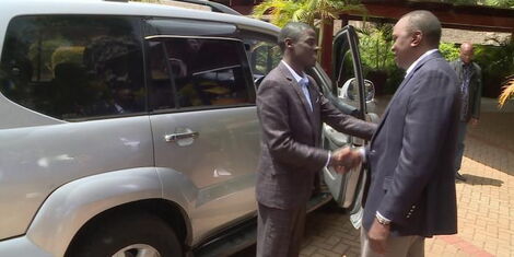 Igembe South MP John Paul Mwirigi accepts gift from President Uhuru Kenyatta.