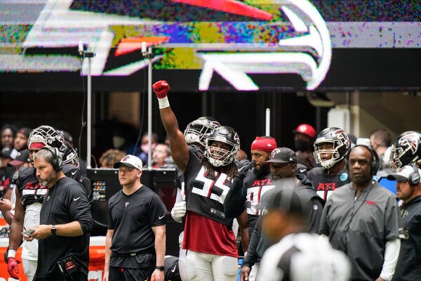 Steven Means (55), a defensive end for the Atlanta Falcons, cheered on his teammates during practice in Atlanta last weekend. The Falcons said that all their players have been vaccinated against the coronavirus.