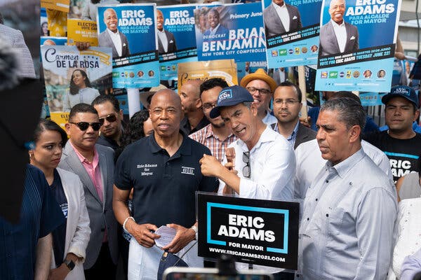 Ydanis Rodriguez, center, is a city councilman and a staunch supporter of Eric Adams, the Democratic mayoral nominee, left.