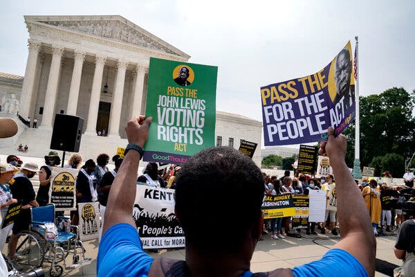 People rallied in support of the John Lewis Voting Rights Act and the For the People Act in Washington last month.