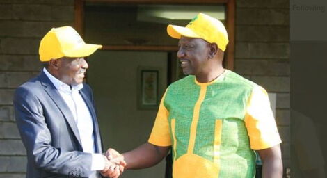 UDA Aspirant Zachariah Baraza (left) shakes hands with Deputy President William Ruto on January 24, 2022.
