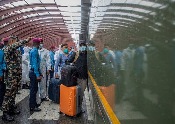 Nepalis arriving at the international airport in Kathmandu last week after being evacuated from Afghanistan.