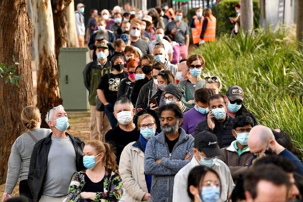 A vaccination line in Sydney on Thursday. An outbreak follows months of near-zero community coronavirus  transmission, but officials expect more cases to arise.