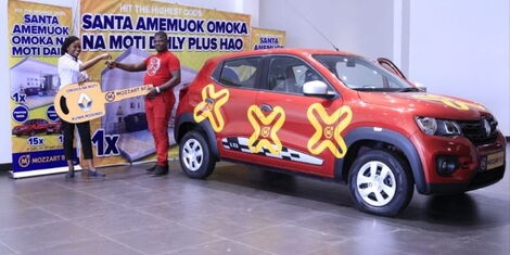 Duncan Lumumba is presented with the car keys for his Renault Kwid on Thursday, December 9, 2021, after winning Mozzart Bet's Omoka na Moti Promotion