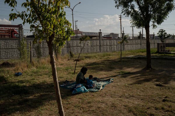 An Afghan refugee with her daughter at a bus station in Van, Turkey, this month.