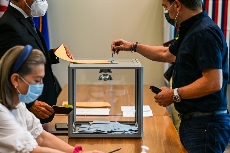 Voting starts as Macron seeks new term in tight French election » Capital News