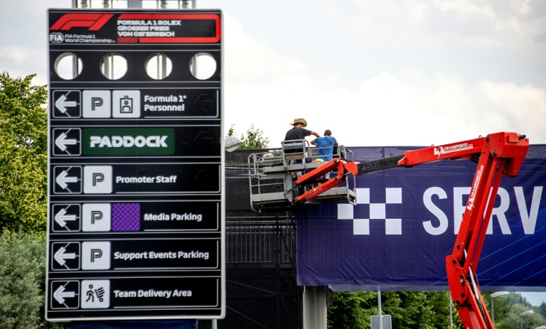 Bubble wrapped: Formula One's masked men keep their distance