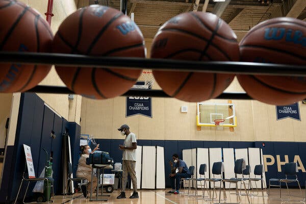 People receiving Covid-19 vaccinations at Pharos Academy Charter School in the Bronx in July.