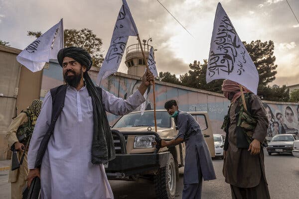 Taliban members outside the closed U.S. Embassy in Kabul on Sunday.