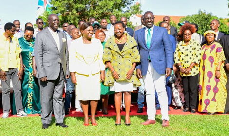 Deputy President William Ruto (right) and his running mate Rigathi Gachagua (left) pose for a photo with their significant others.