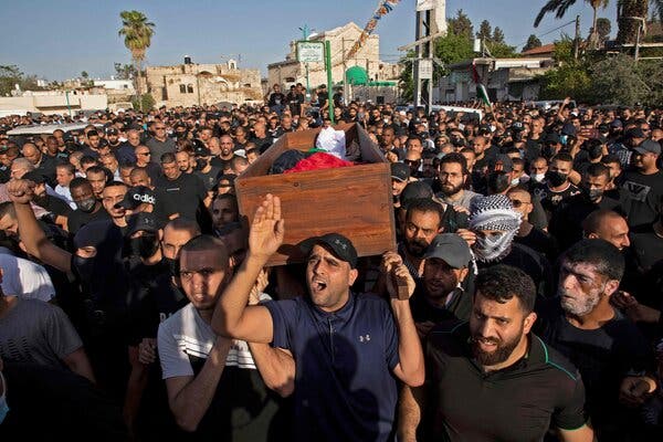 Arab Israelis during a funeral in the Israeli city of Lod on Tuesday.