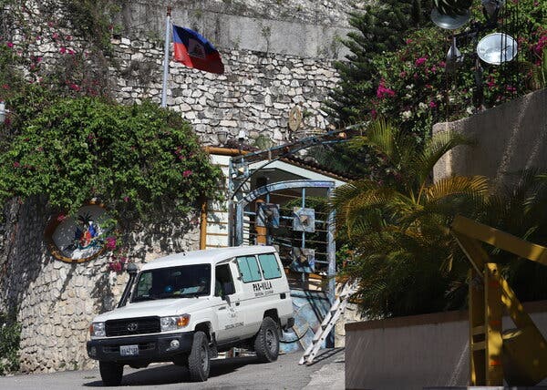 An ambulance carrying the body of President Jovenel Moise in Port-au-Prince, Haiti, on Wednesday.