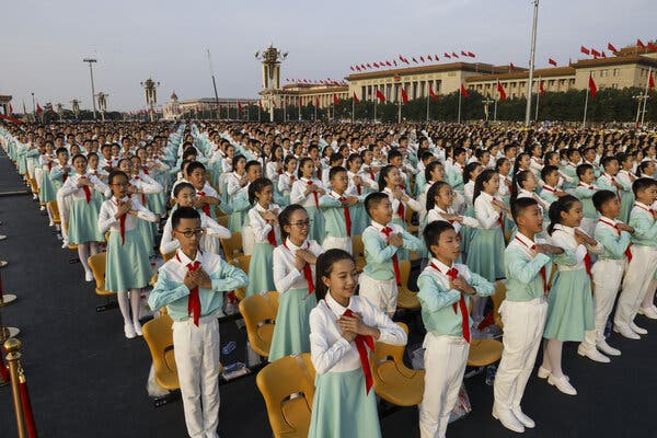 Children rehearsing in Tiananmen Square before a parade marking the 100th  anniversary of the founding of the Chinese Communist Party.