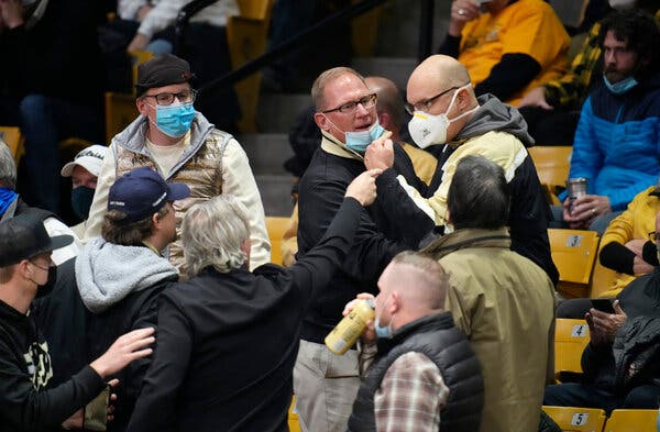 Fans skirmishing over wearing masks during a college basketball game this month in Boulder, Colo.