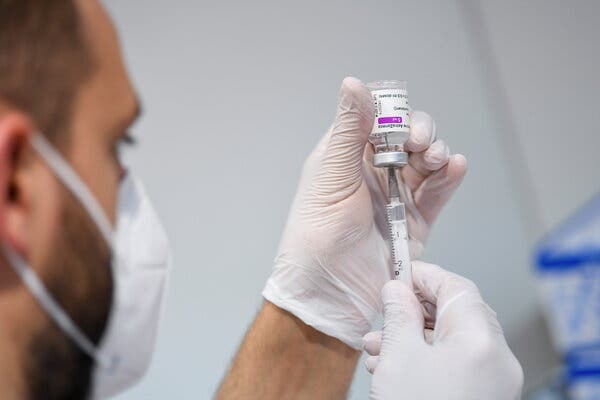 A medical worker in Munich filled a syringe with the AstraZeneca Covid-19 vaccine in May. Germany plans to donate its supplies of the vaccine for use in lower-income countries. 