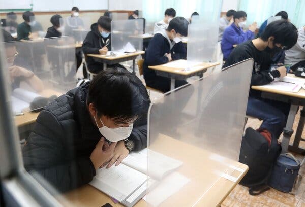 Students taking the college entrance exam at a high school on Jeju Island, South Korea, in December.