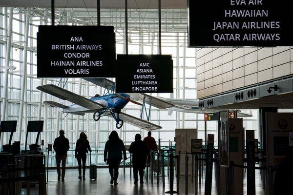 Travelers at Seattle-Tacoma International Airport last month. The European Union says it will be open this summer to American travelers who have been fully vaccinated against Covid-19.