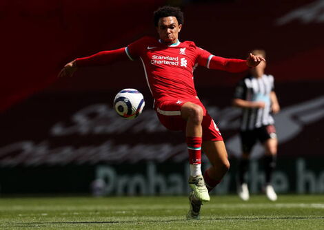 Trent Alexander-Arnold of Liverpool attempts to control the ball during the Premier League match between Liverpool and Newcastle United at Anfield on April 24, 2021
