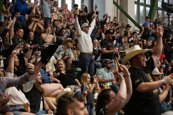 Watching the Stockyards Championship Rodeo in Fort Worth, Texas, where mask mandates have been lifted.