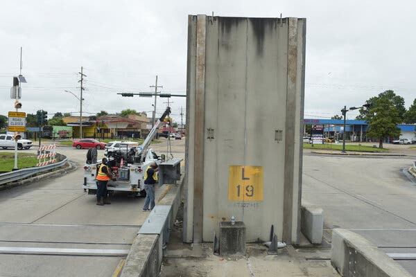 The removal of barriers in New Orleans on Friday will allow floodgates to be closed before Hurricane Ida arrives.