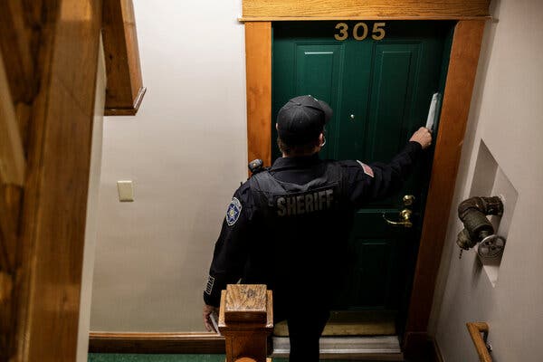 An eviction notice is placed at the door of an apartment in Springfield, Mass., in December. Local officials have been bracing for a rise in evictions as the federal moratorium and similar state and city orders expire this summer.