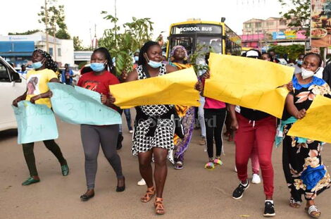 Teachers and parents celebrating good performance at a school