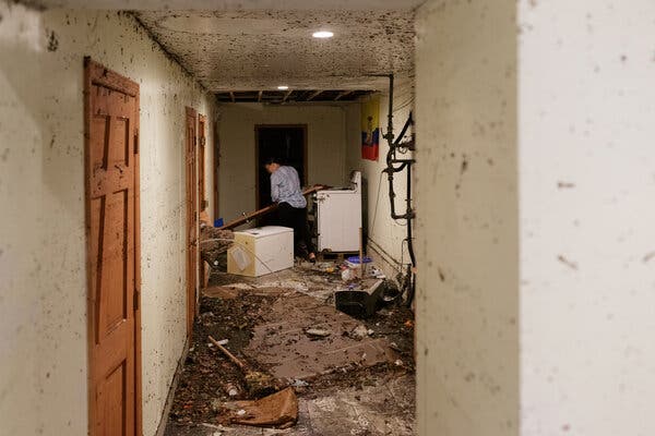 Roxanna Florentino looked at the damage in the basement of the building where she lives in Brooklyn on Thursday. Her neighbor, Roberto Bravo, died there on Wednesday night as surging waters poured in.