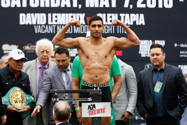 Ex-world champion Amir Khan retires from boxing