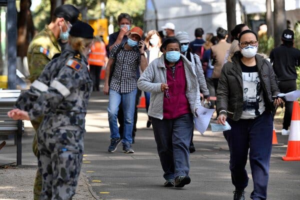 Australian armed forces standing by outside a Covid-19 vaccination site in Sydney on Wednesday.