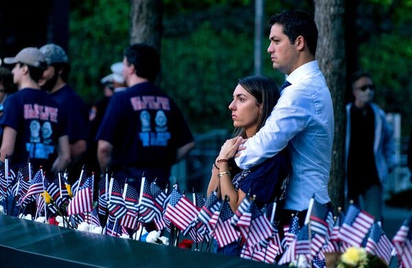 Katie Mascali and her fiancé, Andre Jabban, stood near the name of Ms. Mascali’s father, Joseph Mascali, who was with FDNY Rescue 5.