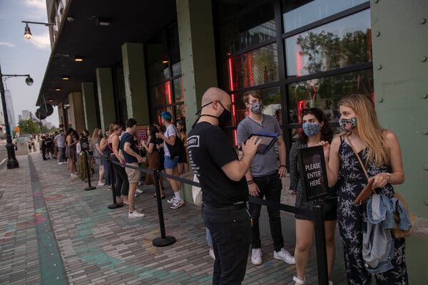 Patrons wait to show proof of vaccination before entering a performance at City Winery in New York City in May.