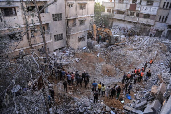 Searching for victims in the rubble of a building in Gaza on Saturday.