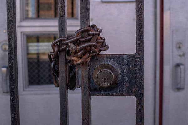 The front doors of Public School 23 in the Bronx. New York officials are preparing to bring students back for only part-time instruction in the fall.