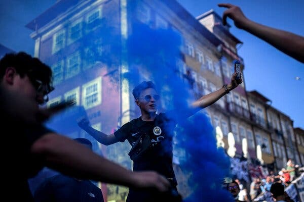 City fans with smoke in Chelsea’s preferred shade of blue.
