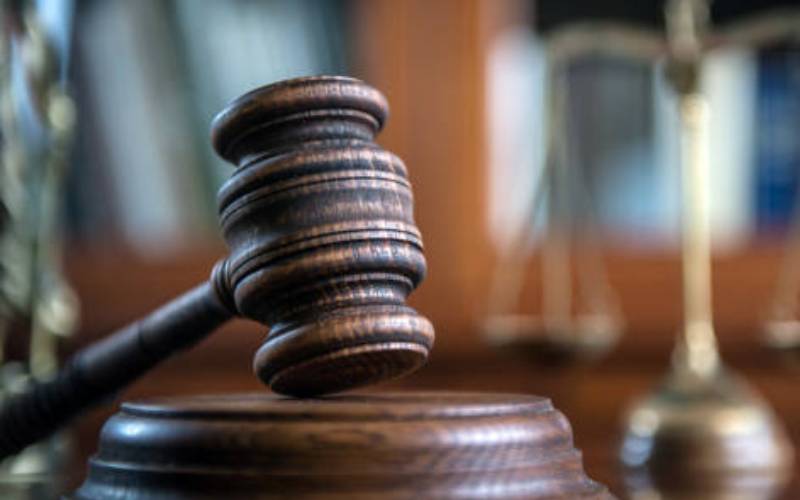 Woman in child's killing 'has a case to answer'