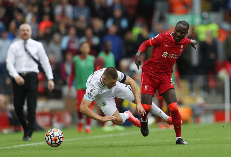 August 21, 2021: Burnley's Johann Berg Gudmundsson in action with Liverpool's Naby Keita. REUTERS