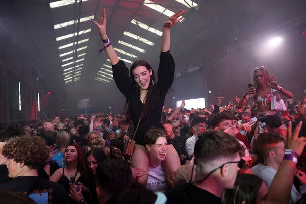 Unmasked clubbers in Liverpool, England, returned to the dance floor as part of an experiment.