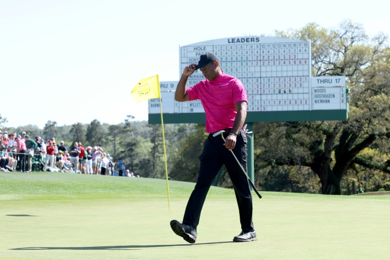 Tiger fights back to stay in the hunt at the Masters