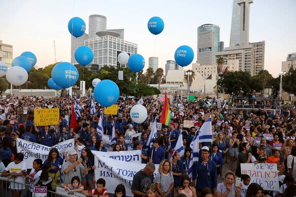 Israeli-born Filipino children with their families at a 2019 protest in Tel Aviv over the deportation of undocumented foreign workers.