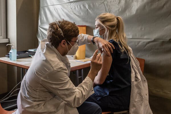 A vaccination at Großhadern Hospital in Munich in March. Germany’s government revealed that Chancellor Angela Merkel had received two different shots, adding to growing interest in vaccine mixing.