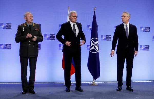 Russia’s deputy defense minister, Aleksandr V. Fomin, left, and deputy foreign minister, Aleksandr V. Grushko, center, with the NATO secretary-general, Jens Stoltenberg, before their meeting in Brussels on Wednesday.