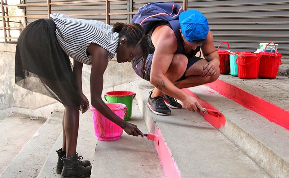 Here's The Girl Behind Those Colourful Street Paintings in Nairobi That You Love