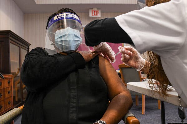Deborah Childs, a staff member at Forest Hills Nursing Home, receiving her second dose of Covid vaccine.