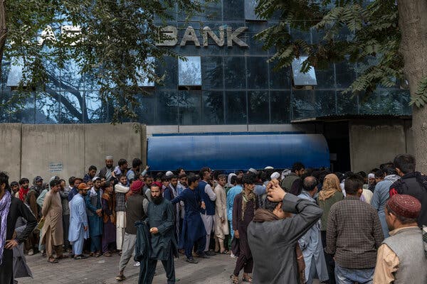 Outside a bank branch in Kabul, Afghanistan, on Monday. Long lines seeking to withdraw money have become a daily norm.